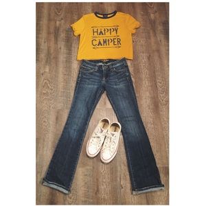 Boot cut jeans and possibly the yellow shirt